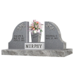 Double headstone with wing shape headstones with last name Murphy and vase in middle